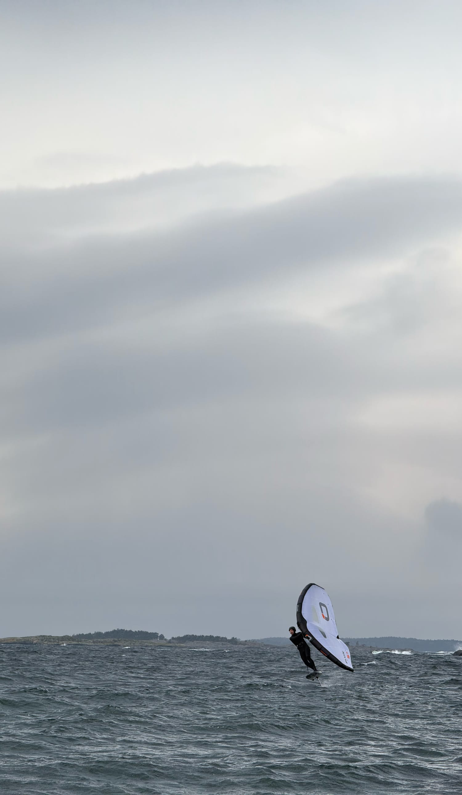 Person wing foiling toe-side — Foil Sessions background image